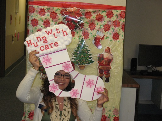 Antonia holding up a sign saying hung with care